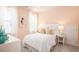 Cozy bedroom featuring soft peach walls and natural light from the large windows at 774 Clay Field Trl, Summerville, SC 29485