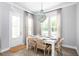 Elegant dining area featuring a modern chandelier and ample natural light at 774 Clay Field Trl, Summerville, SC 29485