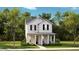 Charming two-story home with a welcoming front porch and well-maintained landscaping at 774 Clay Field Trl, Summerville, SC 29485