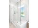 This bathroom features a frameless shower with window and built in bench at 774 Clay Field Trl, Summerville, SC 29485