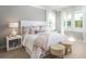 Serene main bedroom with neutral tones, soft textures, and large windows overlooking a private yard at 784 Clay Field Trl, Summerville, SC 29485