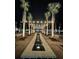 A calming water feature with string lights and Palm trees creates a magical ambiance at night at 784 Clay Field Trl, Summerville, SC 29485