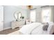 Bedroom with dresser, chair, large mirror and natural light at 786 Clay Field Trl, Summerville, SC 29485