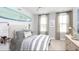 Nautical themed bedroom with gray accents features surfboard decor at 786 Clay Field Trl, Summerville, SC 29485