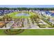 Stunning aerial view of a community with a pond, lush landscaping, and charming homes at 786 Clay Field Trl, Summerville, SC 29485