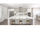Open-concept kitchen with a large island, stainless steel appliances, and pendant lighting at 786 Clay Field Trl, Summerville, SC 29485