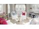 Bright living room with large windows, white furniture and glass coffee table at 786 Clay Field Trl, Summerville, SC 29485