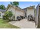 Backyard patio with outdoor seating and a grill, great for entertaining at 7896 Montview Rd, North Charleston, SC 29418