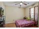 Inviting bedroom with a ceiling fan, TV, and a window letting in natural light at 7896 Montview Rd, North Charleston, SC 29418