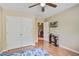 Comfortable bedroom with a ceiling fan, closet, and a view into the hall at 7896 Montview Rd, North Charleston, SC 29418