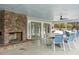 Indoor/outdoor clubhouse with a brick fireplace, seating, and an outdoor view at 7896 Montview Rd, North Charleston, SC 29418