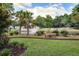 Scenic community park with a pond, fountain, walking path, and mature trees for residents to enjoy at 7896 Montview Rd, North Charleston, SC 29418