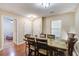 Spacious dining area with a table, six chairs, and seamless access to other living spaces at 7896 Montview Rd, North Charleston, SC 29418