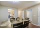 Open-concept dining area showcasing a table with six chairs, next to the kitchen and living room at 7896 Montview Rd, North Charleston, SC 29418