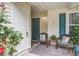 Inviting front porch with cozy seating, decorative touches, and a charming entrance at 7896 Montview Rd, North Charleston, SC 29418