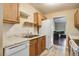 Bright kitchen features wooden cabinets, granite countertops, and modern white appliances at 7896 Montview Rd, North Charleston, SC 29418