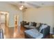 Relaxing living room with comfy sectional couch, wooden floors, and view into the kitchen at 7896 Montview Rd, North Charleston, SC 29418