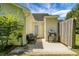Exterior patio with grill, door to shed, and a bench with gray cushions at 7896 Montview Rd, North Charleston, SC 29418