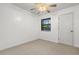 Bedroom with neutral carpeting, ceiling fan and window offering natural light at 7914 Dutch Ct, North Charleston, SC 29420