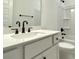 Bathroom features a white vanity with dark fixtures, a modern mirror, and a shower-tub combo at 8633 Connor Ct, North Charleston, SC 29406