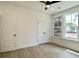 Bright bedroom with wood floors, double closets, ceiling fan, and natural light from the window at 8633 Connor Ct, North Charleston, SC 29406