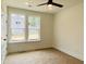 Bright bedroom featuring a ceiling fan, lots of natural light, and neutral walls at 8633 Connor Ct, North Charleston, SC 29406