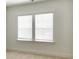 Bedroom windows with blinds let in plenty of natural light and provide a bright, airy atmosphere at 8633 Connor Ct, North Charleston, SC 29406