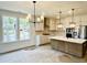 Bright, spacious kitchen with stainless appliances, a large island, and modern light fixtures at 8633 Connor Ct, North Charleston, SC 29406