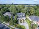 Beautiful two-story home with mature trees, a large driveway, and water views nearby at 8657 Refuge Point Circle Cir, Charleston, SC 29420