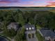 Nighttime aerial view of a charming two-story home with river views in a serene neighborhood at 8657 Refuge Point Circle Cir, Charleston, SC 29420
