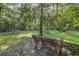 Beautiful backyard offers a park bench to enjoy the quiet and peaceful surroundings at 8657 Refuge Point Circle Cir, Charleston, SC 29420