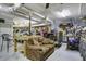 Eclectic basement featuring a vintage couch, multiple vehicles, a workbench, and a range of decor at 8657 Refuge Point Circle Cir, Charleston, SC 29420