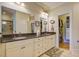 Bathroom features double sinks with granite countertops and a walk-in closet at 8657 Refuge Point Circle Cir, Charleston, SC 29420
