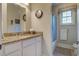 Bathroom with granite countertop, white cabinets, and a shower and tub area at 8657 Refuge Point Circle Cir, Charleston, SC 29420