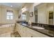 Bathroom features double sinks with granite countertops and a soaking tub at 8657 Refuge Point Circle Cir, Charleston, SC 29420