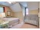 Bedroom featuring a bed and crib with unique architecture and natural lighting from a window at 8657 Refuge Point Circle Cir, Charleston, SC 29420