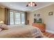 Comfortable main bedroom with soft natural light and an area to kick back and relax at 8657 Refuge Point Circle Cir, Charleston, SC 29420