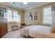 Bedroom showcasing a bed, natural light from windows, and classic wood furniture at 8657 Refuge Point Circle Cir, Charleston, SC 29420