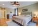 Comfortable bedroom features a ceiling fan, area rug, and lots of natural light at 8657 Refuge Point Circle Cir, Charleston, SC 29420