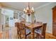 Classic dining room with wood floors, chandelier lighting and staircase at 8657 Refuge Point Circle Cir, Charleston, SC 29420
