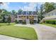 Charming two-story home with a spacious driveway, lush lawn and appealing traditional design at 8657 Refuge Point Circle Cir, Charleston, SC 29420