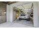Functional garage showcasing a truck with custom touches, paired with exposed storage and decor at 8657 Refuge Point Circle Cir, Charleston, SC 29420