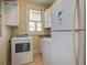 Efficient laundry area equipped with a washer, dryer, and storage cabinets at 8657 Refuge Point Circle Cir, Charleston, SC 29420