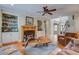 Bright living room with fireplace, hardwood floors, custom cabinets and staircase at 8657 Refuge Point Circle Cir, Charleston, SC 29420