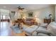 Inviting living room with hardwood floors, ceiling fan, staircase and comfortable seating at 8657 Refuge Point Circle Cir, Charleston, SC 29420