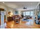 Comfortable living room with hardwood floors, fireplace, ceiling fan and multiple windows at 8657 Refuge Point Circle Cir, Charleston, SC 29420