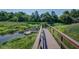 Picturesque boardwalk extends into a marsh, offering a serene view of the water and natural surroundings at 8657 Refuge Point Circle Cir, Charleston, SC 29420