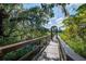 Scenic boardwalk through marsh, creating a peaceful escape into nature and beautiful views at 8657 Refuge Point Circle Cir, Charleston, SC 29420