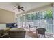 Comfortable screened-in porch with cozy seating and views of the surrounding nature at 8657 Refuge Point Circle Cir, Charleston, SC 29420