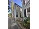 Charming two-story home featuring a well-maintained exterior and brick stairs leading to the entrance at 9 West St # 1, Charleston, SC 29401